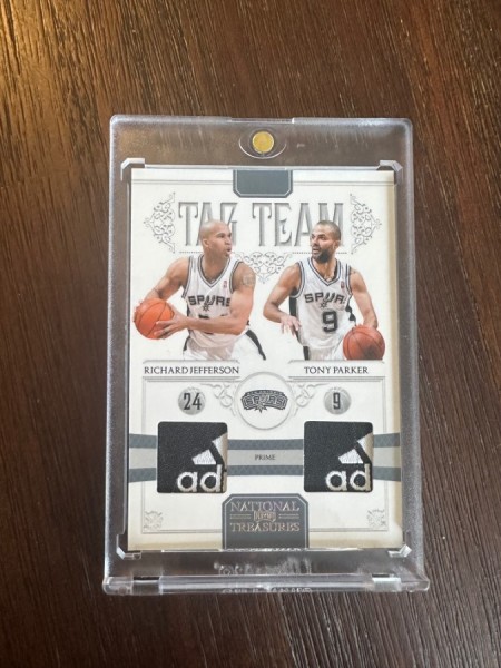 2011 National Treasures 1/4 game worn tags